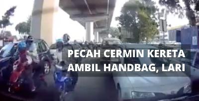 Ragut sewaktu jalan sesak. Pecah cermin, ambik handbag